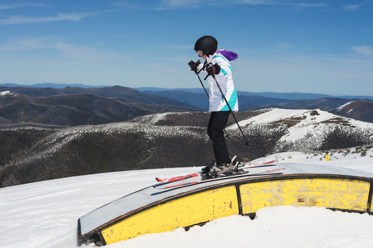 teen skier having fun on jumps and slides