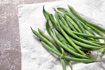 Pile of fresh green French beans on table