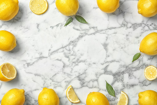 Flat lay composition with lemons on marble background