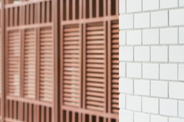 White tiled wall and wood lath wall pattern