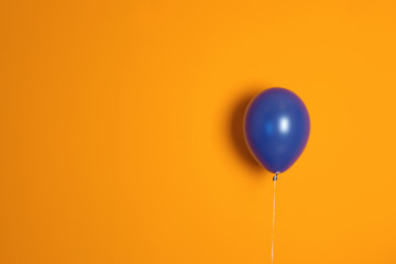 Purple balloon on color background. Celebration time