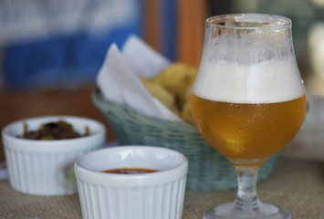 Bar food: glass of beer with appetizers