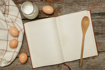 Creating a recipe. Blank paper surrounded by basic ingredients. Add own text.
