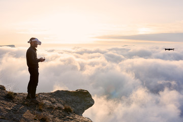 Amazing view of man in vr headset with remote controller on top
