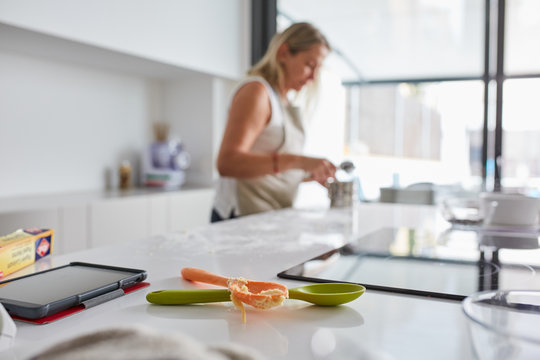 Woman baking homemade cookies in her kitchen