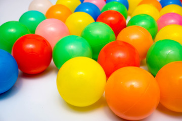 colorful plastic balls on a white background