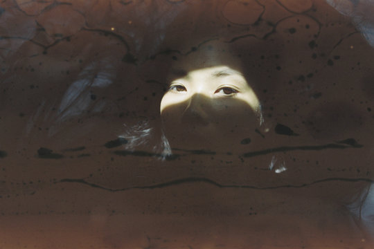 Portrait of woman with shadow play on face