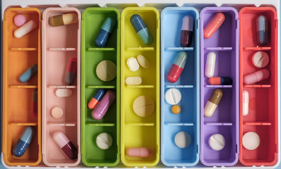 Close Up Of Colorful Case With Pills And Tablets