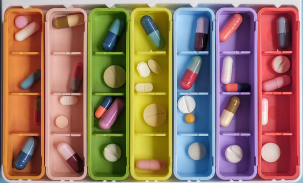 Close Up Of Colorful Case With Pills And Tablets