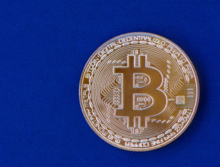 one bitcoin on a blue background