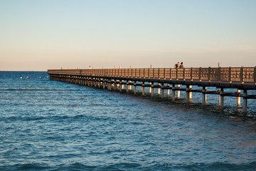 Fototapeta premium Beach of the red sea, waves, pier