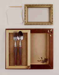 Frames with herbs and spices and cutleries. Copy space. 