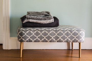 winter rugs on a bench seat at home