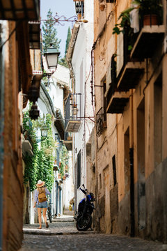 Woman doing tourism with map at Granada, Spain.