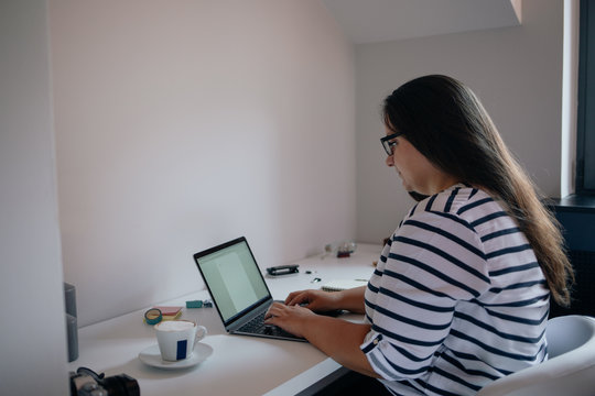 Young Woman Working at Home