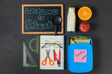 School lunch box with school supplies,