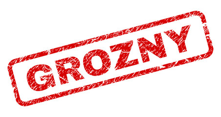 GROZNY stamp seal print with grunge style. Red vector rubber print of GROZNY text with grunge texture. Text label is placed inside rounded rectangle frame.