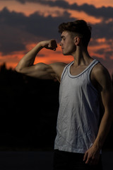 Young adult male outside at sunset