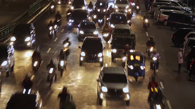 JAKARTA, Indonesia - July 17, 2018: Time lapse of highway traffic on rush hour at night in Jakarta city. Shot in 4k resolution