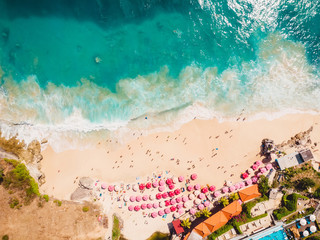 Aerial view of sandy beach with turquoise ocean in Bali. Dreamland beach.