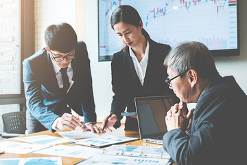 Business concept. Business people discussing the charts and graphs showing the results of their successful teamwork.