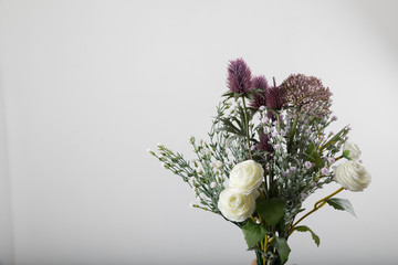 fresh bouquet of fresh flowers on light background.