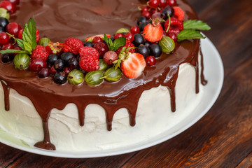 Modern homemade chocolate cake with fresh berries