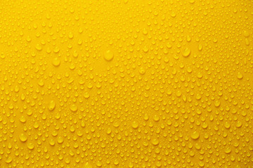 Rain or Water drops on yellow background