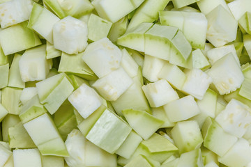 Chopped fresh summer zucchini pieces background