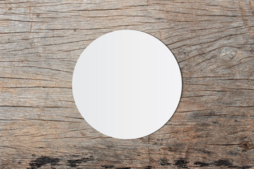 White circle paper and space for text on old wooden background