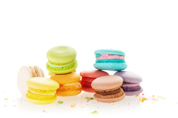 Colourful french macarons on white background.
