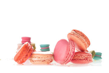 Mixed size of french macarons on white background