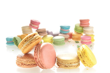 Mixed size of french macarons on white background