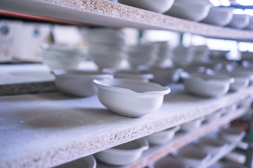 Ceramic dishes in working process. Creating ceramic pieces. Tradicional ceramic factory in spain