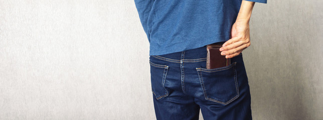 Putting wallet in back side of jean