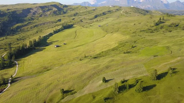 Aerial drone landscape of the meadows at high altitudes, forming soft hills. Dolomites, Alta Badia, Sud Tirol, Italy
