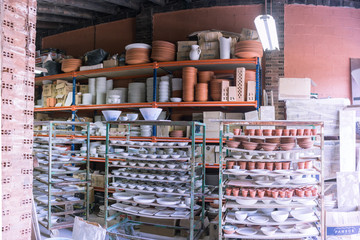 Ceramic dishes in working process. Creating ceramic pieces. Tradicional ceramic factory in spain