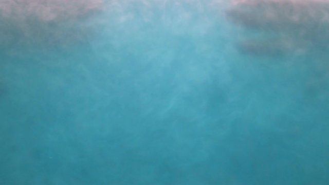Silhouettes of hands floating in blue mist, concept of memories, oblivion