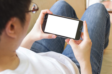 man using mobile smart phone in living room
