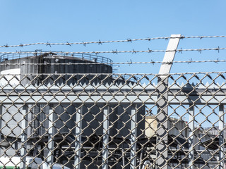 Fence with barbed wire