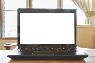 laptop computer with blank screen on desk