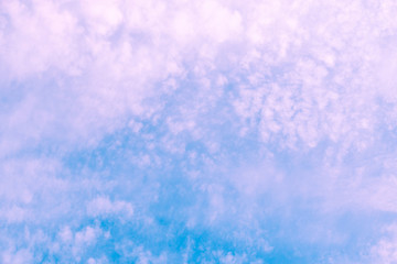 violet clouds on blue sky. background texture.
