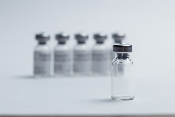 Medical vials for medicines on white background close-up