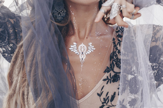 Close up of fashionable stylish woman with boho accessories outdoor