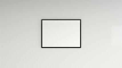 Blank white poster in black frame on the wall