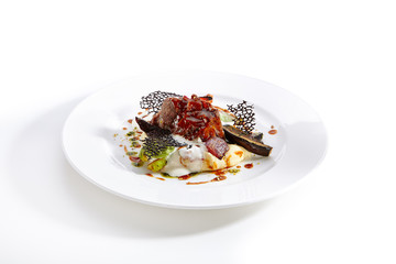 Delicacy cuisine served on round shaped plate