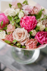 beautiful summer bouquet. flower arrangement with peonies. Color light pink. The concept of a flower shop.