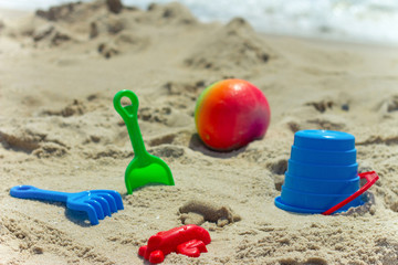 toys airplane for childrens sandboxes against the sea and the beach