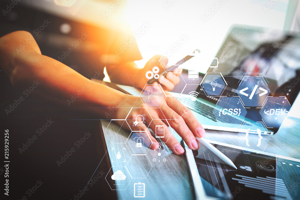 Poster businessman hand attending video conference with laptop computer and tablet computer at desk in offi