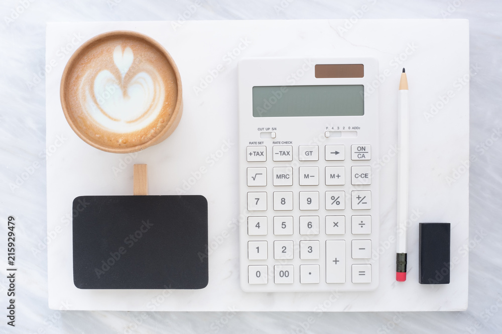 Poster Top view of blackboard, pencil, eraser calculator and coffee cup on white marble block and stack on grey marble table.Flat lay Mock up template for adding or display text or design.Stationery item.